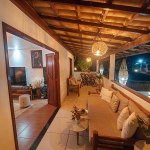 a living room with a couch and a table at Residência Thomas in Itacaré