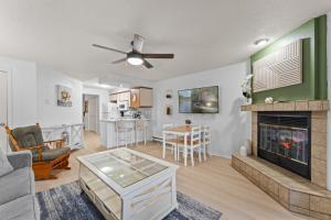 a living room with a couch and a fireplace at Dells Suite Dreams At Lighthouse Cove Condominiums in Wisconsin Dells