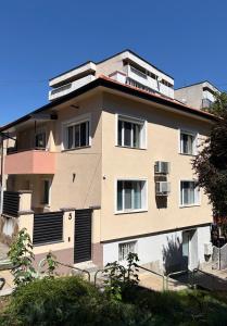 a large apartment building with windows on the side at Water House in Shumen