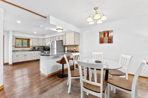 a kitchen and dining room with a table and chairs at Dells Family Stacation in Wisconsin Dells
