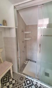 a shower with a glass door in a bathroom at Casa con embarcadero in Los Mártires +21 photos