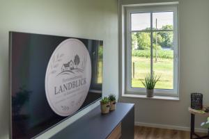 a room with a large surfboard on the wall at Ferienwohnung Landblick in Borken
