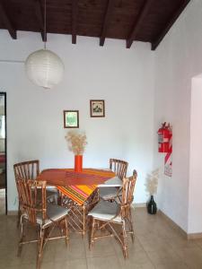a dining room with a table and chairs at Arcadia in Merlo