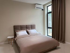 a bedroom with a large bed and a window at Luxe House Odessa Private Jacuzzi BBQ, Free Parking in Odesa