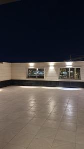 a empty building with lights on the side of it at STAYs ستايز in Medina