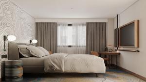 a hotel room with a bed and a television at Holiday Inn Express Yalova by IHG in Yalova +31 photos