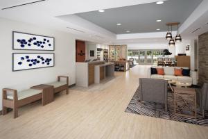 a lobby of a hospital with a waiting room at Candlewood Suites Rowlett - Lake Ray Hubbard by IHG in Rowlett