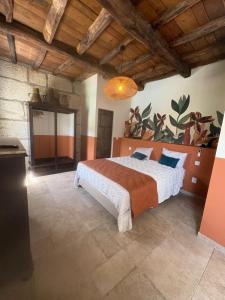 a bedroom with a large bed in a room at Valadouro Dona Adelaïde With a Pool in Espinhosa +61 photos