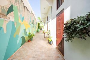 an empty hallway with potted plants in a building at Casa Donderis in Santo Domingo
