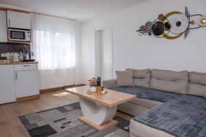 a living room with a couch and a table at Apartman Živković in Leskovac