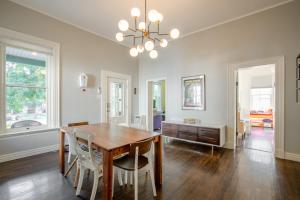 a dining room with a wooden table and chairs at Kid-Friendly Stay with Backyard: Long Stays in Salt Lake City