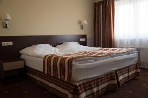 Postel nebo postele na pokoji v ubytování Hotel Druzhba
