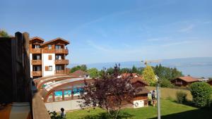 a building on a hill with a view at Les chalets d Evian in Évian-les-Bains +2 photos