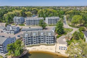 an aerial view of a resort with a lake and buildings at Dells Family Stacation in Wisconsin Dells