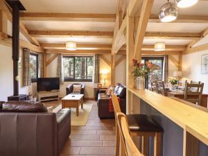 a living room with a bar in a house at Lady Bagots Cabin in Ruthin
