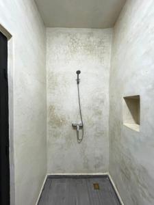 a bathroom with a shower in a wall at Kaouki paradise tafoukt in Essaouira