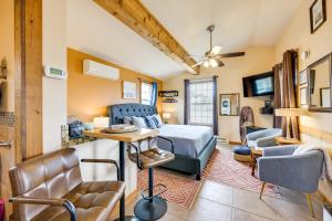 a bedroom with a bed and a living room at Cute Studio Cabin Steps to Long Beach Boardwalk in Long Beach