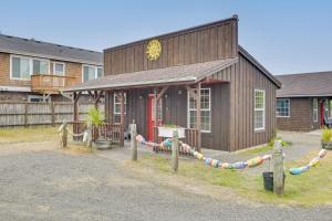 a wooden building with a volley ball court at Cute Studio Cabin Steps to Long Beach Boardwalk in Long Beach