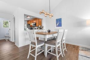 a kitchen and dining room with a table and chairs at 1211 Creekwatch Villa in Seabrook Island