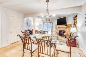 a dining room and living room with a table and chairs at Beachwalk 124 in Hilton Head Island