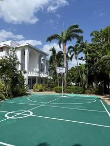 a basketball court in front of a house at Paradise View- Oceanfront Oasis in Runaway Bay