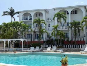 a view of the hotel from the pool at Paradise View- Oceanfront Oasis in Runaway Bay