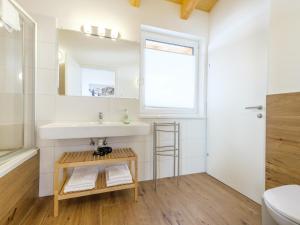 a bathroom with a sink and a mirror at Hochkönigblick I in Werfenweng +34 photos