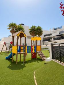 a park with a playground with a slide at Skandi home in Gran Alacant