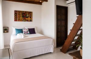 a bedroom with a bed in a room at Pousada Villa Grauçá in Morro de São Paulo
