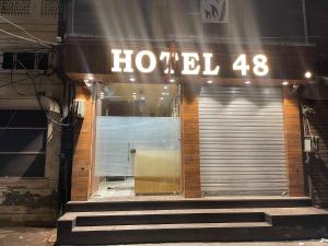 a hotel sign on the front of a building at Hotel 48 in Amritsar