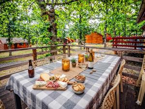 a table with food and bottles of beer and drinks at Le Beau Renard in Heure