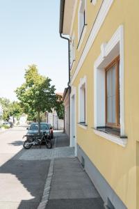 a motorcycle parked on a sidewalk next to a building at Pirkners Home in Sooss