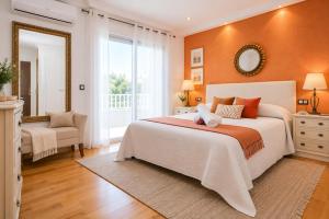 a bedroom with a large bed and a mirror at Casa MEDITERRANEA in Salou +38 photos