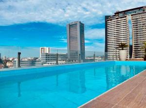 a swimming pool on the roof of a building at Sirari Palm 102 in Santa Cruz de la Sierra