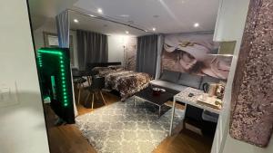 a living room with a couch and a table at Luxury KIA Room K in Richmond Hill