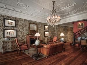 a living room with a couch and a fireplace at M Maison Particulière Porto in Porto
