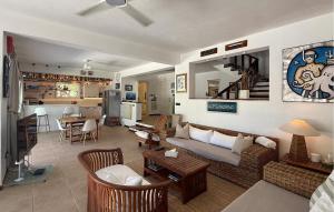 a living room with a couch and a table at Villa Aqua in Vrbanj