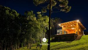 a house on a hill with a sign in front of it at Cabana Bad Wolf - Rancho Queimado - SC in Rancho Queimado +64 photos