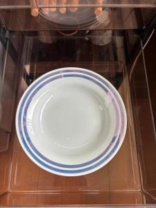 a plate is sitting on a glass table at Aoi-Yane Traditional Japanese House in Kumano Kodo Nakahechi in Tanabe +19 photos