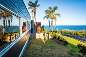 a house with a view of the ocean at East Lane in Tathra