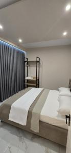 a bedroom with a large bed and a window at Lavéa Villa in Draç +67 photos