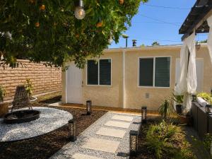 a backyard with a fire pit and a house at Tiny Studio in Orange Garden in Los Angeles