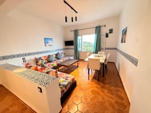 a living room with a couch and a table at Résidence CHATT C3 in Cabo Negro