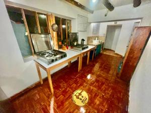 an overhead view of a kitchen with a stove at Intihuatana Hostel in Pisac