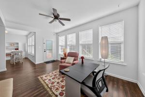 a dining room and living room with a table and chairs at Spacious Family Gathering Space Privacy Zones Quiet, Convenient Neighborhood in Middletown