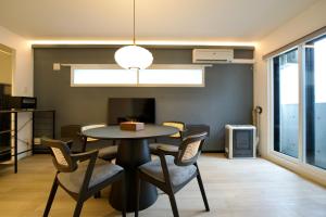 a dining room with a table and chairs at Grand Success Kotoni ll in Sapporo