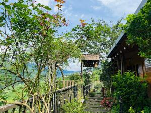 a stairway leading up to a house with trees at TaVan Eco Home in Tả Van