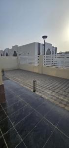 an empty parking lot in front of a building at AlSeef 161 in Al Sharqiyah