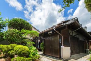 a house with a gate in front of it at 古民家一棟貸 鴨部巣 kamobese in Kochi