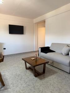 a living room with a couch and a coffee table at Apart Mirador del Valle in Cachí